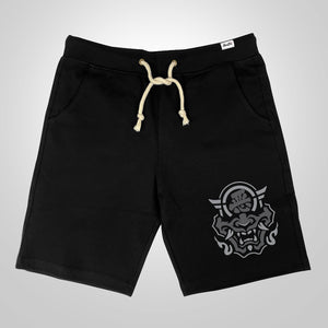 Hannya Mask - A Japanese style black shorts featuring a graphic design of the Japanese Hannya mask, printed on the left.