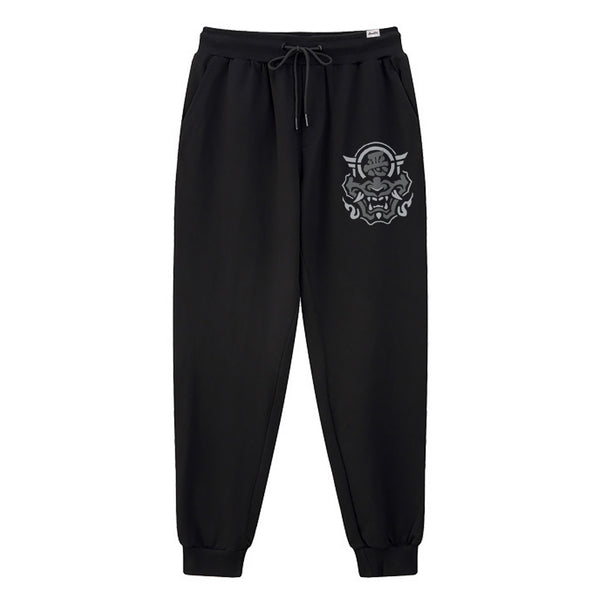 hannya mask - A Japanese style black sweatpants featuring a graphic design of the Japanese Hannya mask, printed on the left.
