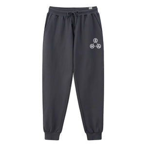 Mudra - A Japanese style dark grey sweatpants featuring a design of religious mantras, printed on the left.