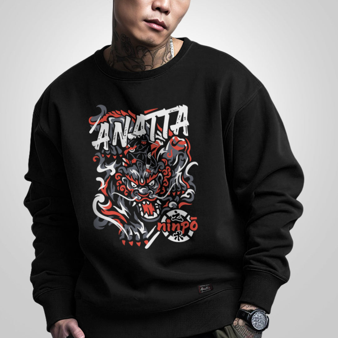 a model wearing a black sweatshirt, featuring a design showcasing a ninja controlling a mythical beast, printed on the front - anatta streetwear