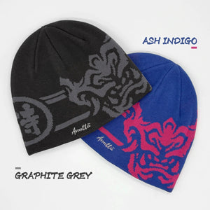 Two beanies, one black and one blue with red pattern, on a white background.