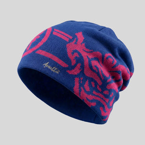 Blue beanie with red patterns on a gray background