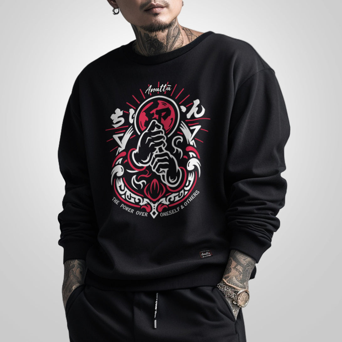 Retsu - a model wearing a black sweatshirt featuring a design of the Japanese ninja gestures printed on the front.
