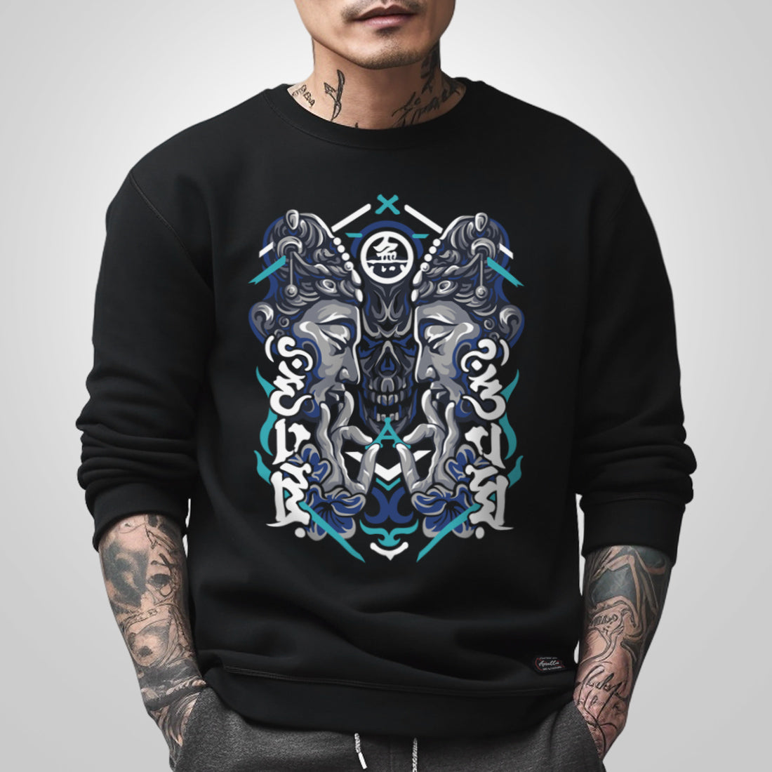 Umarekawari - a model wearing a black sweatshirt, featuring a design of Buddhas confronting the evil illustration on the front