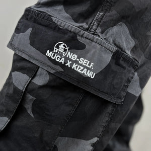 Black camouflage pants with a design printed on the pocket - Anatta Streetwear
