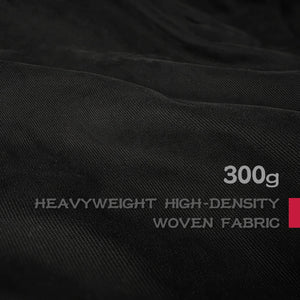 Close-up of black fabric with text indicating '300g Heavyweight High-Density Woven Fabric'. - Anatta Streetwear