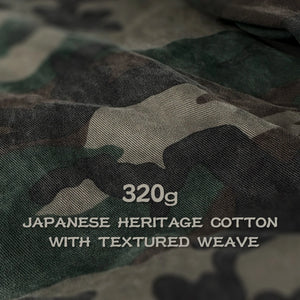 Camouflage fabric with text indicating weight and material details - Anatta Streetwear