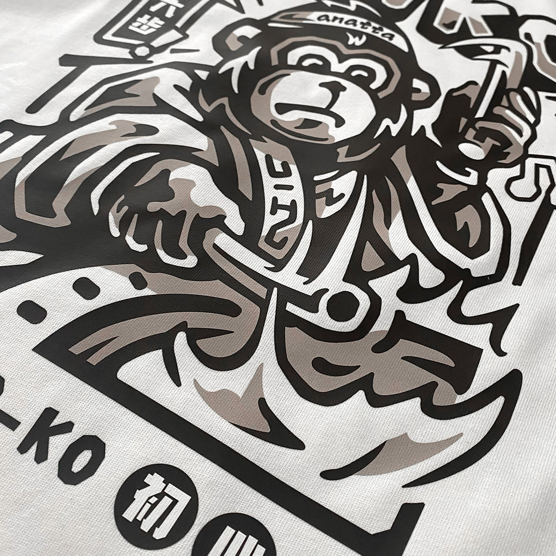 Taiko - a close-up of a graphic design featuring a monkey dressed in traditional Japanese clothing playing a taiko drum, printed on the front -2