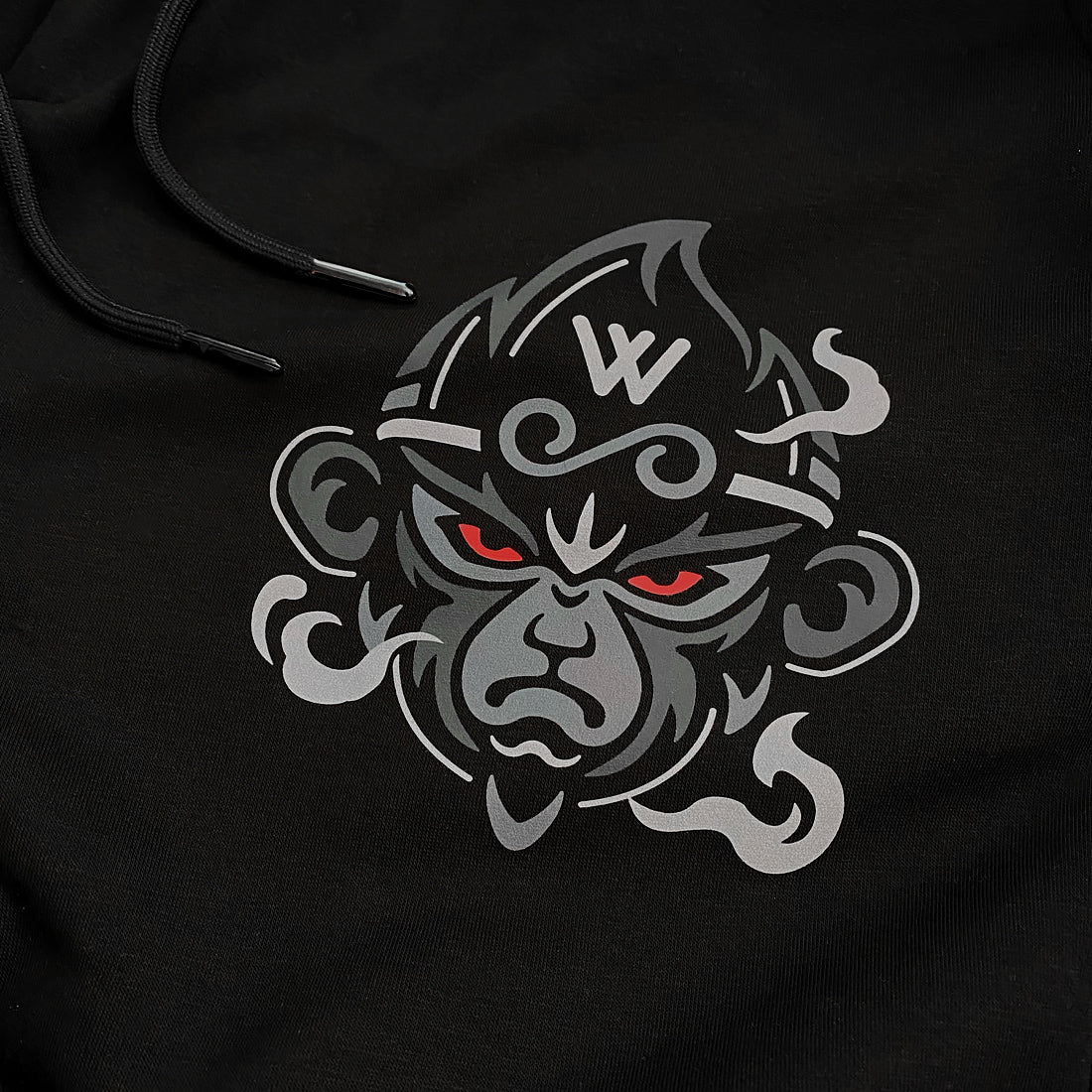 a close-up of the great sage wukong, printed on the Japanese style black sweatpants