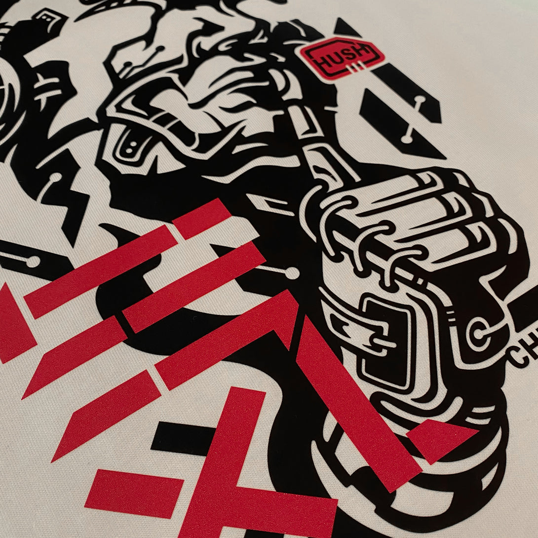Chinmoku- a close-up of the design of a Japanese mecha-style robot face printed on the front of the khaki sweatshirt - 2