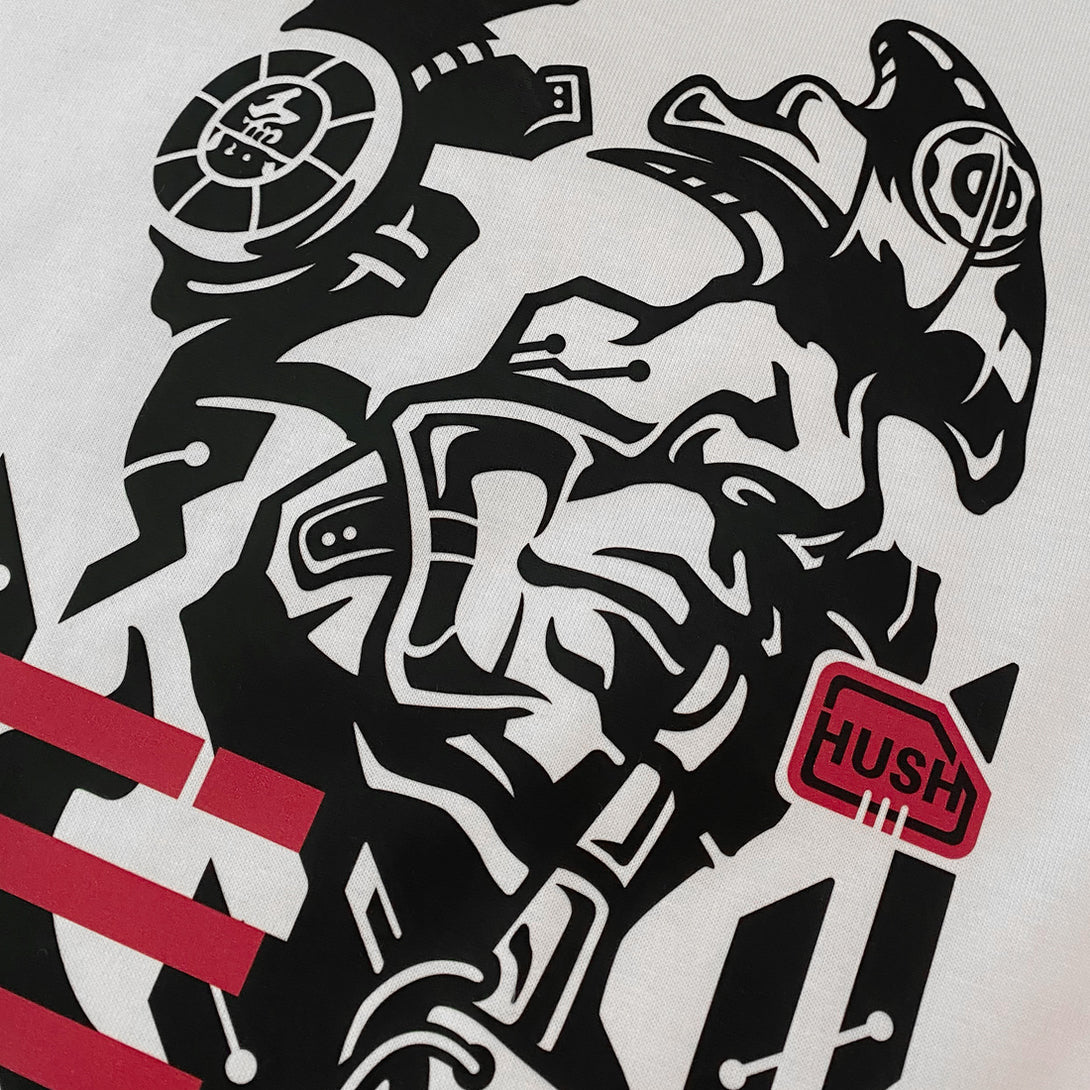 Chinmoku - a close-up of the design of a Japanese mecha-style robot face printed on the front of a Japanese style white heavyweight T-shirt -2
