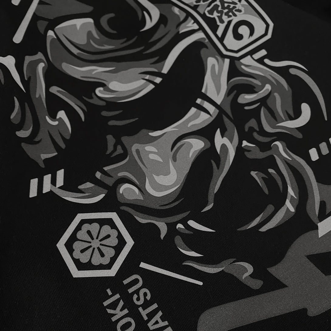 unleash emotion's complexity - a close-up of the graphic design of traditional Japanese demon mask printed on the front of a Japanese style black heavyweight T-shirt -2