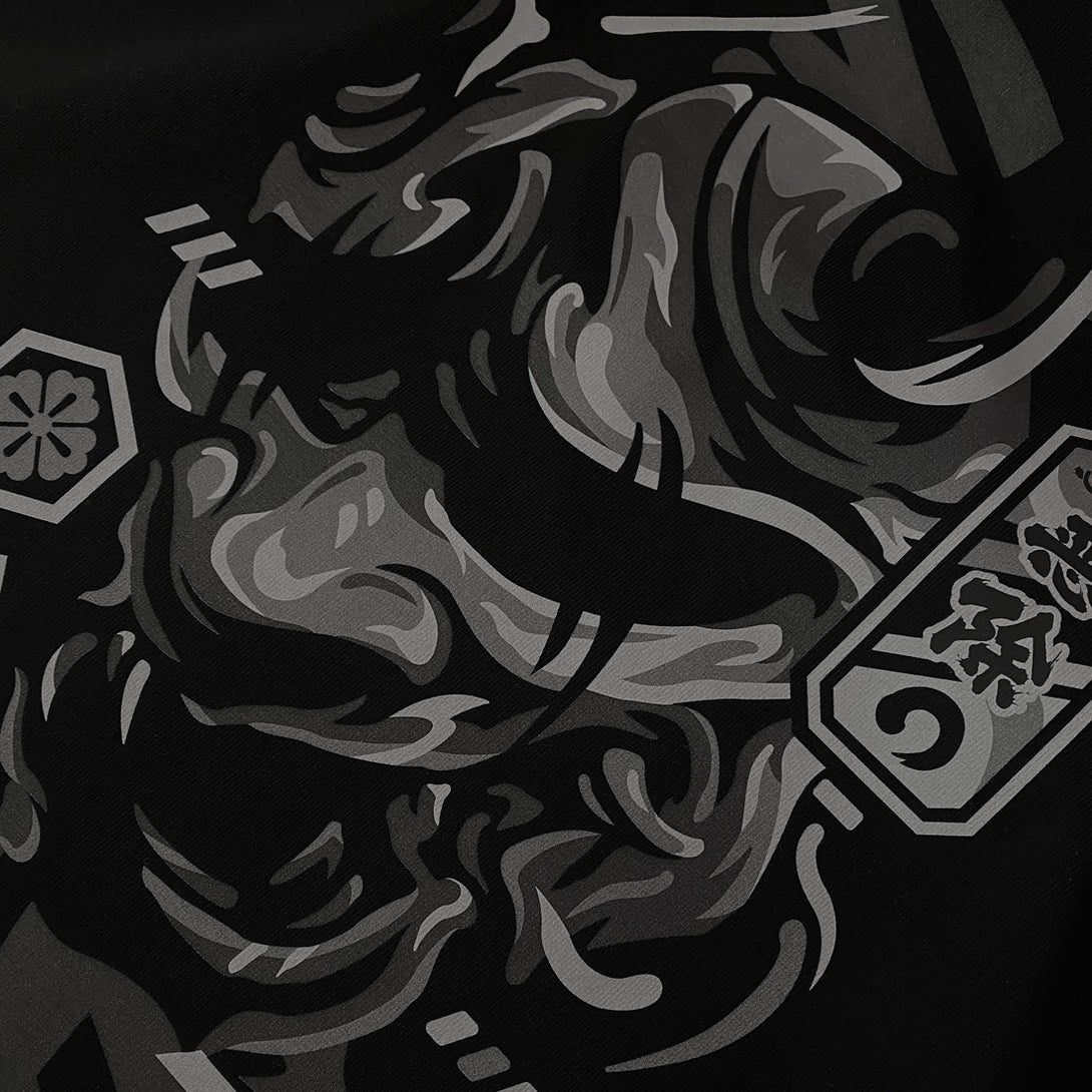 unleash emotion's complexity - a close-up of the graphic design of traditional Japanese demon mask printed on the front of a Japanese style black heavyweight T-shirt -1