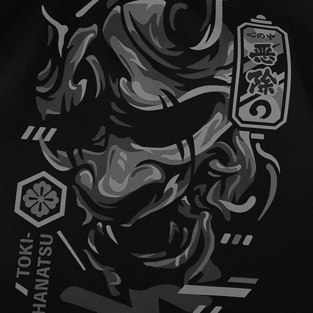 unleash emotion's complexity - a close-up of a traditional Japanese demon mask design on a black Japanese sweatshirt's front-1