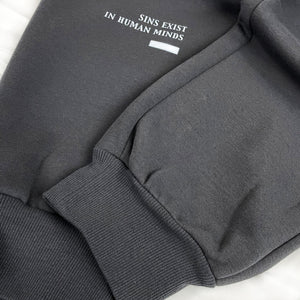 Sins Exist In Human Minds - a close-up of the craftsmanship at the hem of the Japanese style dark grey sweatpants.