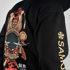 Kabuto - a model wearing a black hoodie with the intricate illustration of a Japanese samurai helmet printed on the back-back view-3