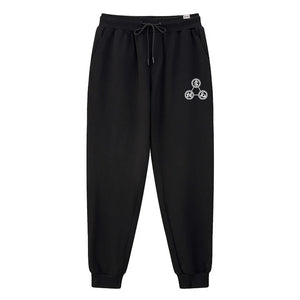 Mudra - A Japanese style black sweatpants featuring a design of religious mantras, printed on the left.