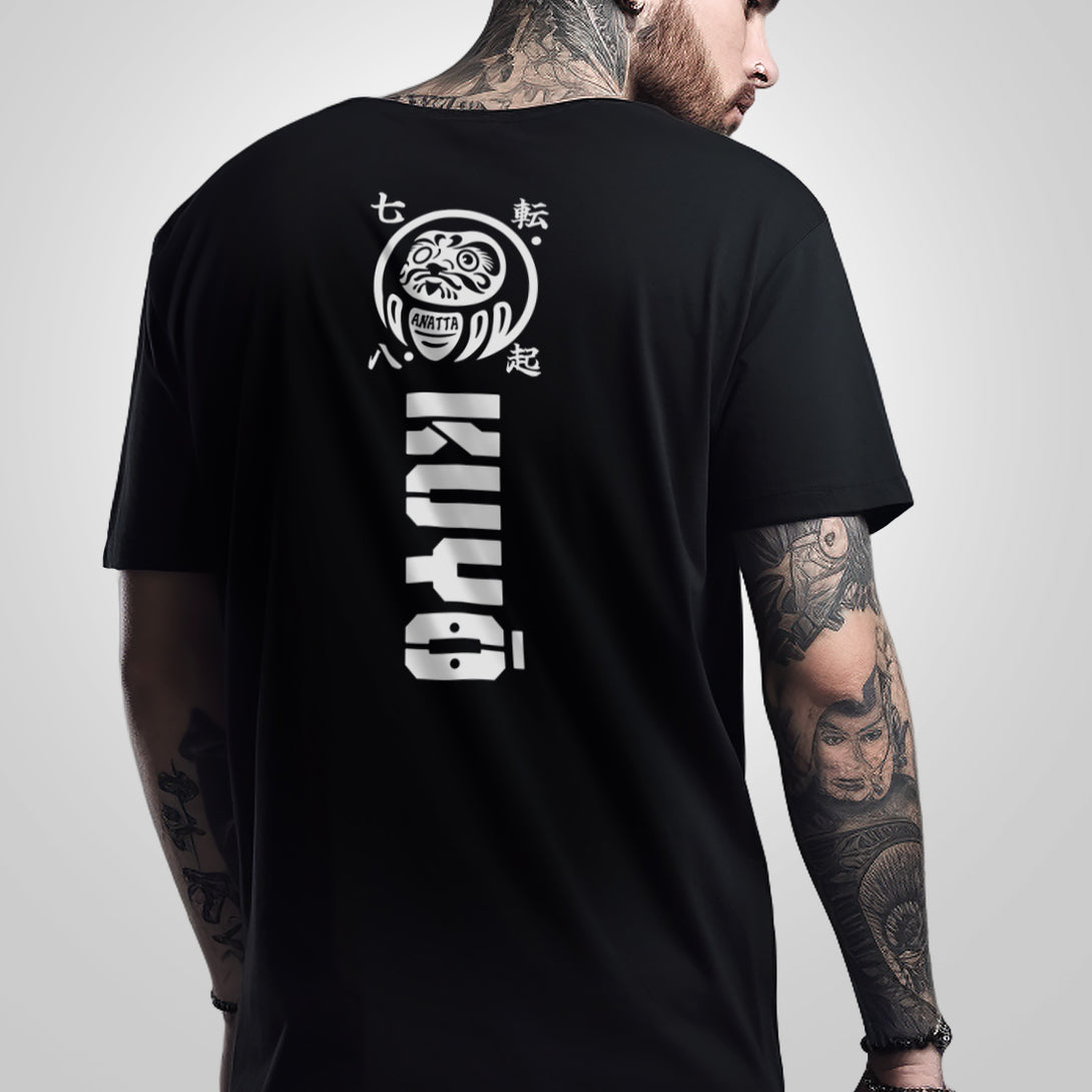 Daruma kuyō - a model wearing a Japanese style black heavyweight T-shirt featuring a design of daruma doll, printed on the back-back view