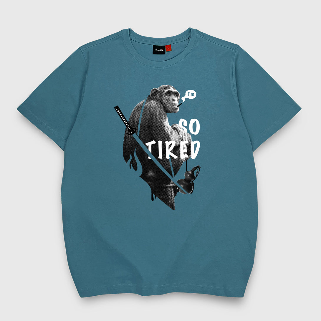 So Tired - a Japanese style blue stone heavyweight T-shirt featuring a graphic design of a tired monkey smoking, printed on the front