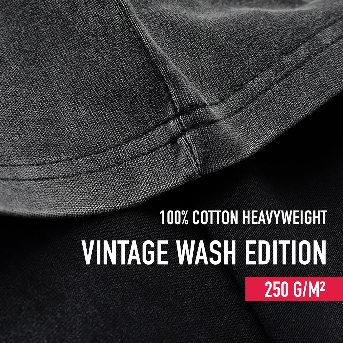 Close-up of a vintage black fabric with '100% Cotton Heavyweight Vintage Wash Edition' text and weight information.