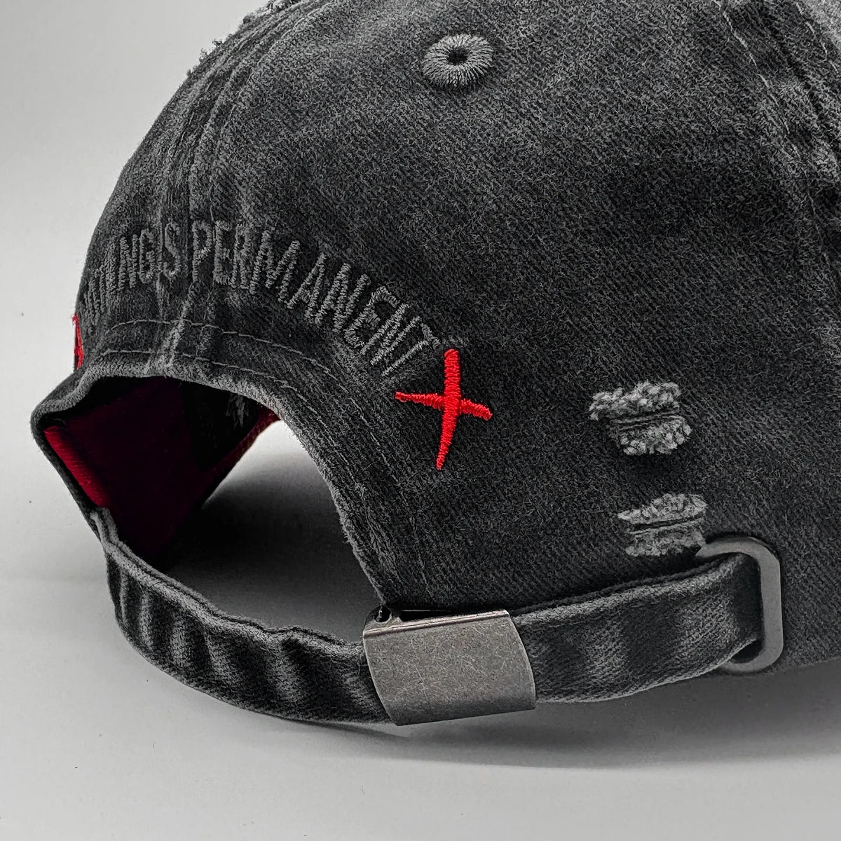 Grey distressed cap with red 'X' and text on a light gray background - Anatta Streetwear