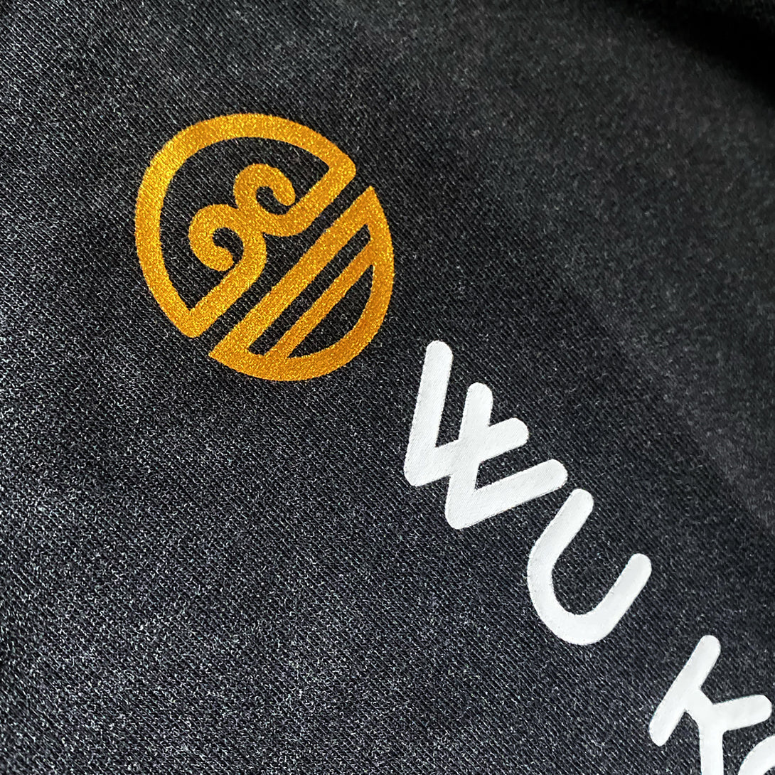 a close up of the special edition wukong tee - vintage wash - gold ink print - anatta streetwear -2