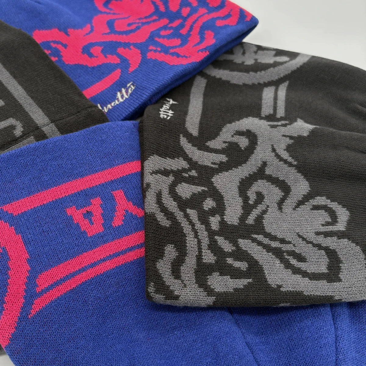 Four graphic toques from Anatta in two colorways displayed together-2