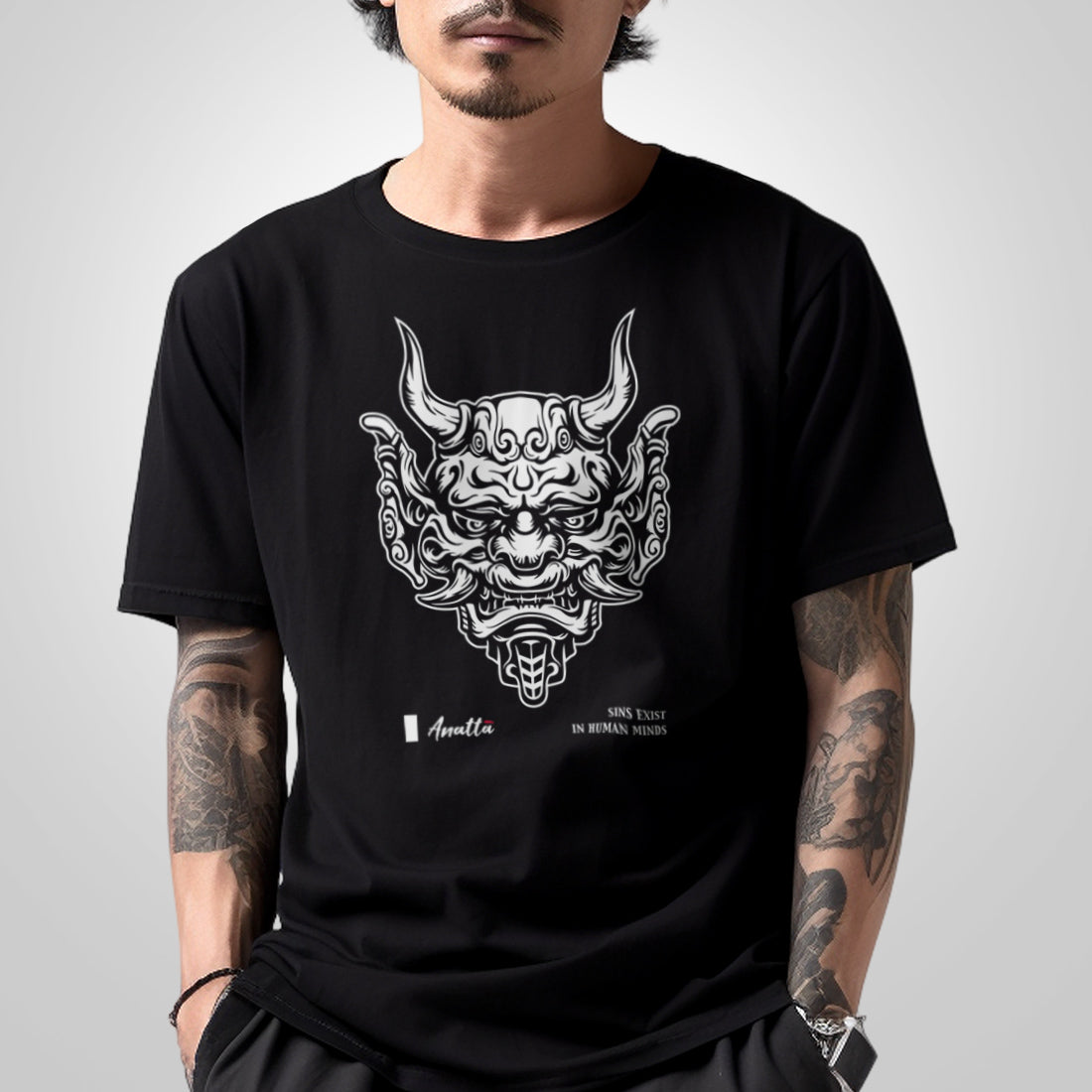 Sins Exist In Human Minds - a model wearing a Japanese style black heavyweight T-shirt featuring the graphic design inspired by Japanese Oni masks, printed on the front