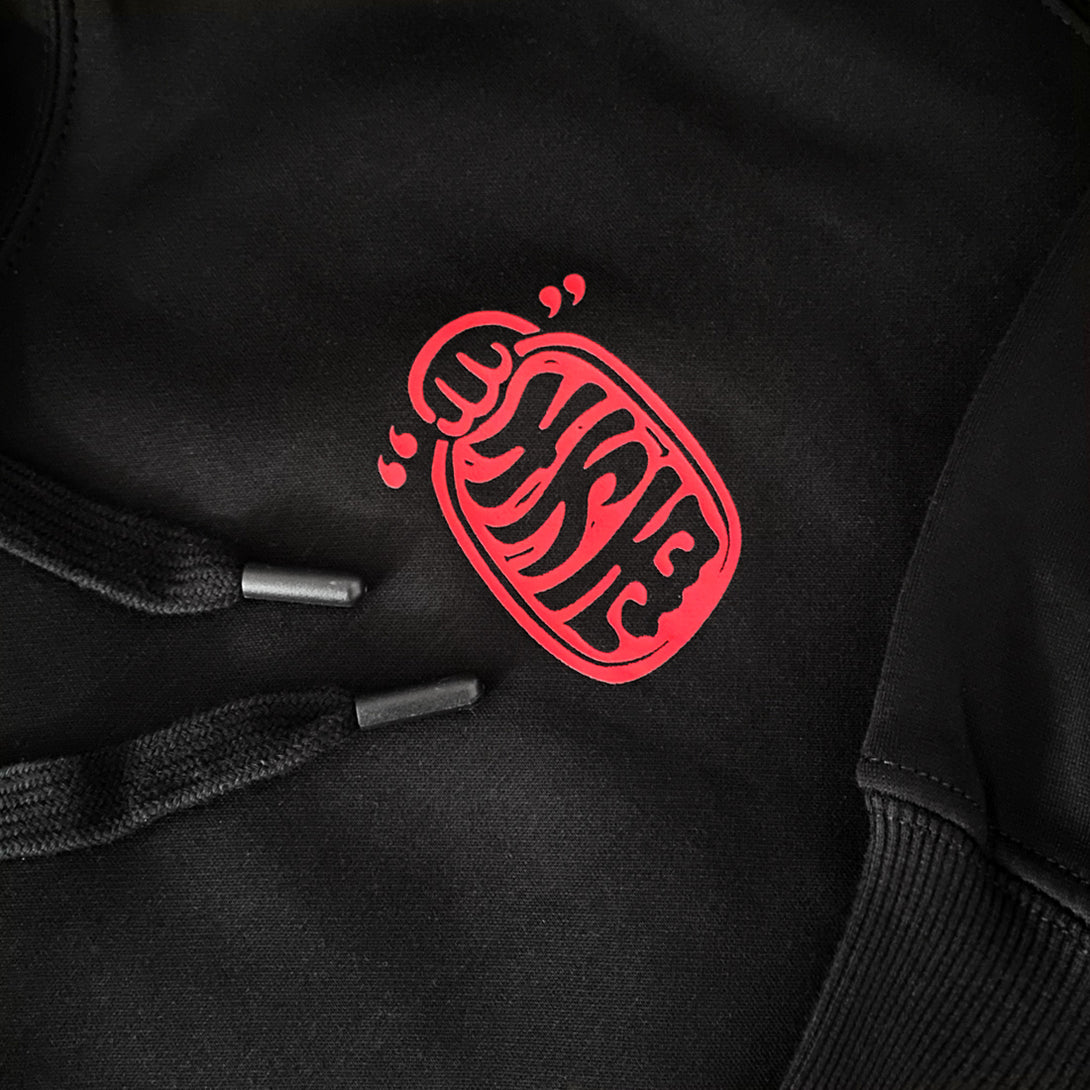  a close-up of the graphic design printed on the front of the Japanese style black hoodie