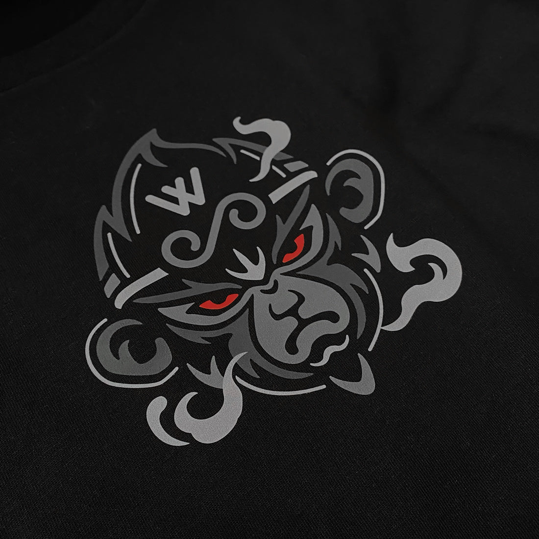 a graphic design of the great sage wukong, printed on the front of a black tank top - Anatta Streetwear