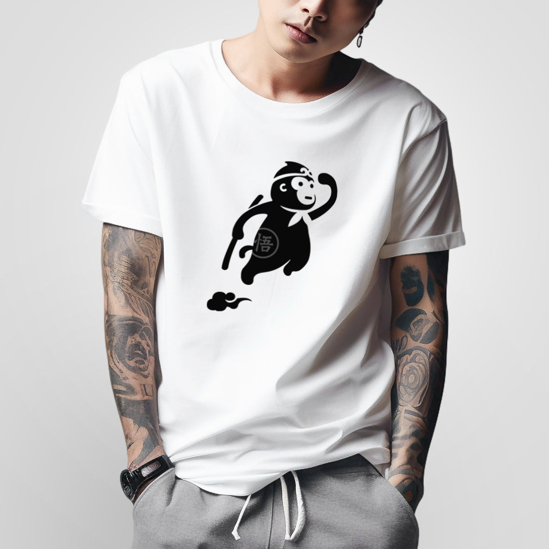 a model wearing a Japanese style white heavyweight T-shirt featuring a cute design of the oversized wukong, printed on the front - Anatta Streetwear