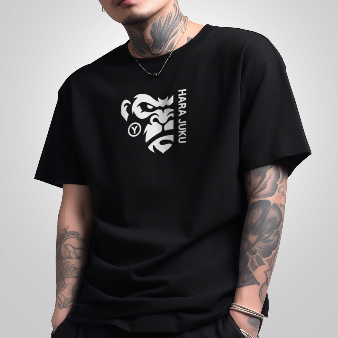 a model wearing a Japanese style black heavyweight T-shirt featuring a graphic design of the angry ape, printed on the front - Anatta Streetwear