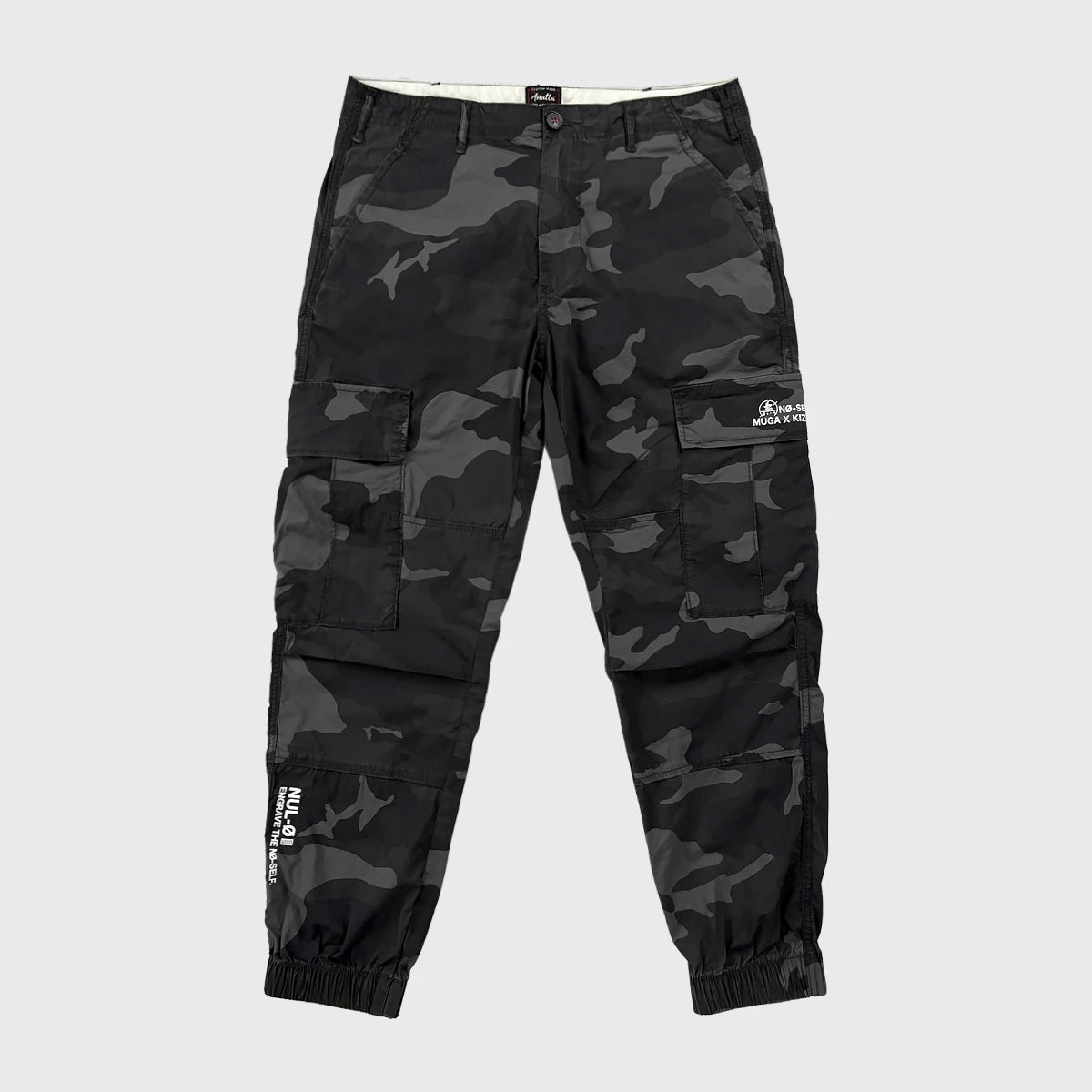Black camouflage cargo pants on a light gray background - Anatta Streetwear
