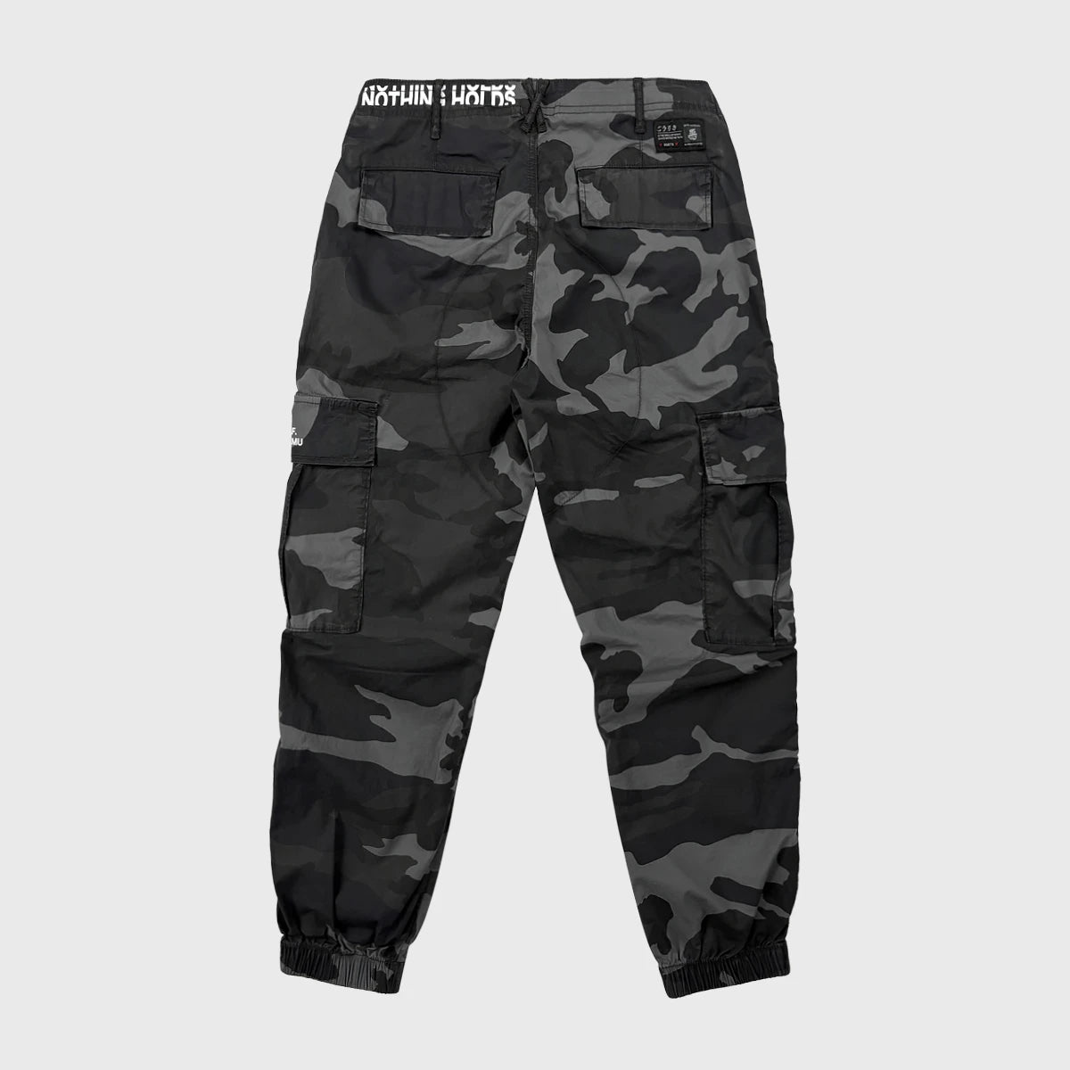 Back view of Camouflage cargo pants on a light gray background- Anatta Streetwear