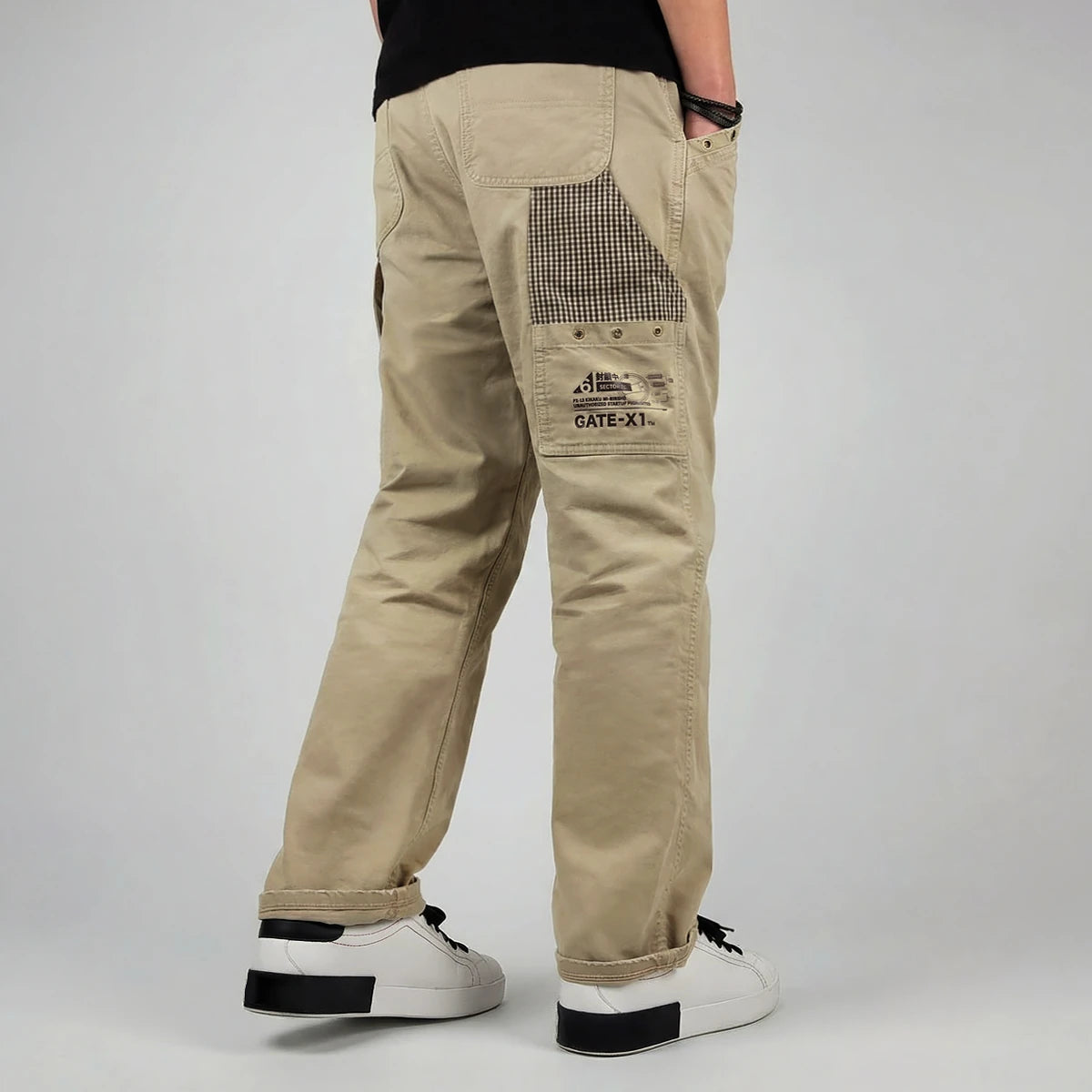 model wearing khaki cargo pants on a plain background - Anatta Streetwear