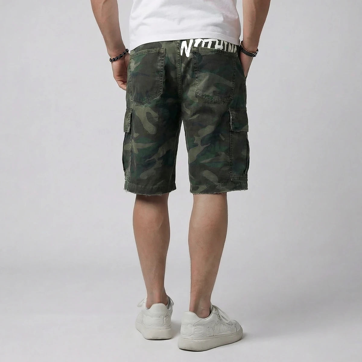 model wearing Camouflage shorts on a plain background - Anatta Streetwear