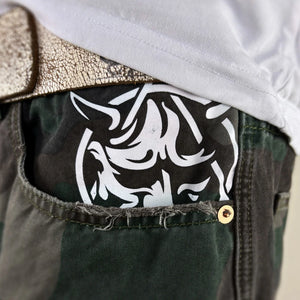 Close-up detail of the white Hannya design on the shorts pocket - Anatta Streetwear