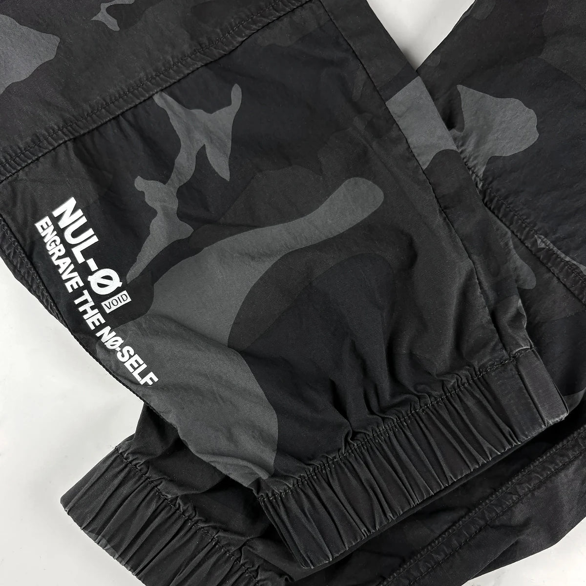 Cargo pants graphic print on leg close-up  - Anatta Streetwear