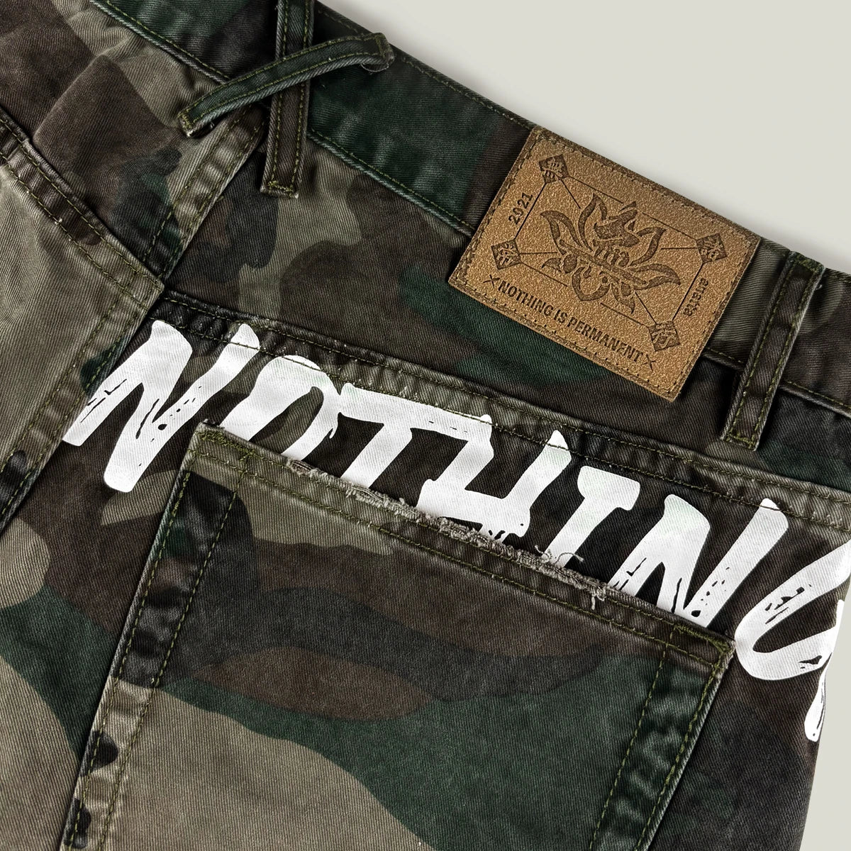 Camouflage cargo shorts featuring leather patch and graphic text – Anatta Streetwear