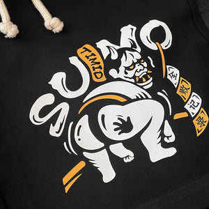 Timid Sumo - a close-up of a cute design of a timid sumo printed on the right of a black shorts-1