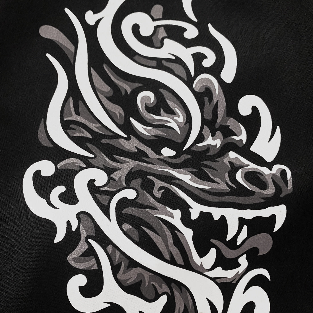 Buddhism Dragon Guardian - a close-up of a design of a Buddhism Dragon Guardian printed on the left of a Japanese style black sweatpants