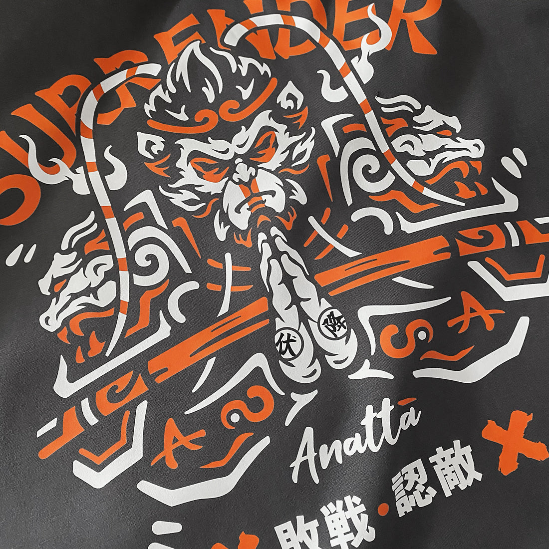 The close-up of a graphic design of Sun Wukong Surrendering, printed on the back of a Japanese style dark grey hoodie-1 - Anatta Streetwear