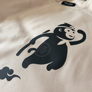 a close-up of a cute design of the oversized wukong, printed on the front of the Japanese style Khaki sweatshirt - Anatta Streetwear