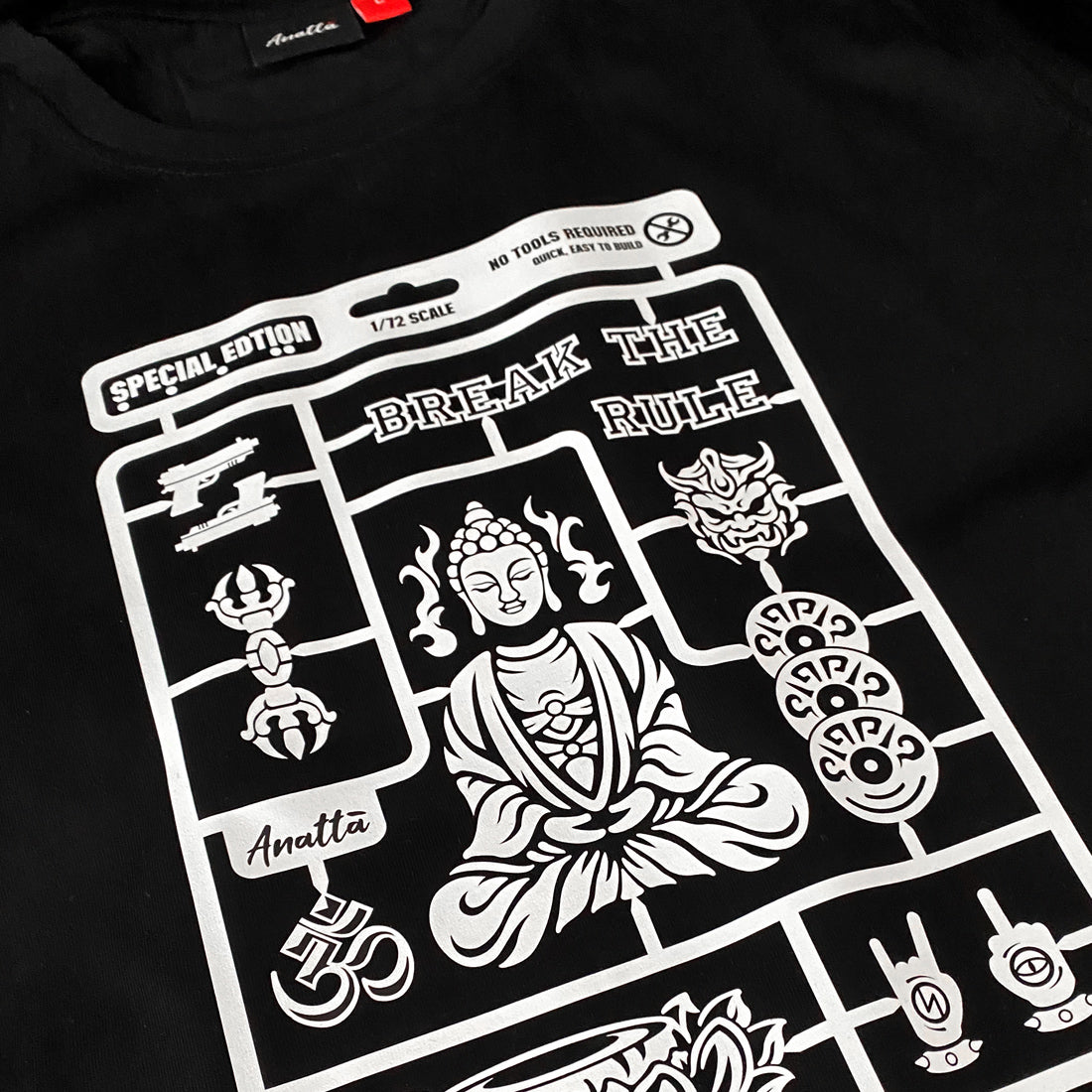 Buddha model kit - a close-up of a vintage-style Buddha model kit design printed on the front of a Japanese style black heavyweight T-shirt -1
