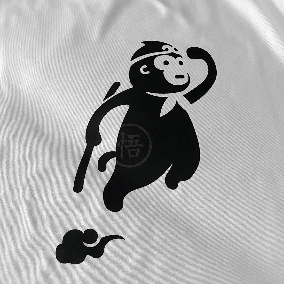 a close-up of a cute design of the oversized wukong, printed on the front of a bluestone heavyweight T-shirt -1 - Anatta Streetwear