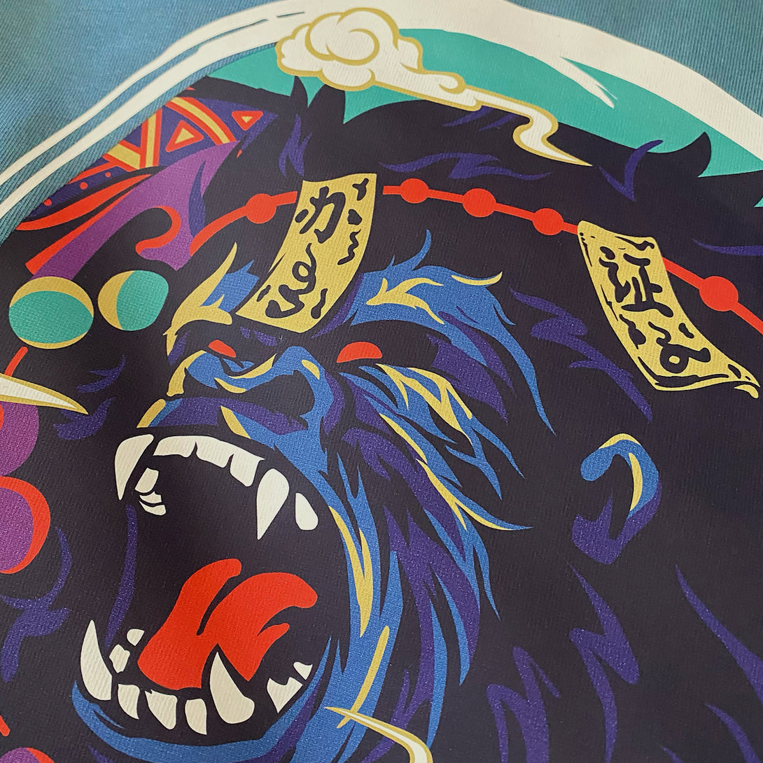 Roaring Ape - a close-up of a graphic design of the ape subdued by Daoist talismans, printed on the front of a Japanese style blue stone heavyweight T-shirt -2