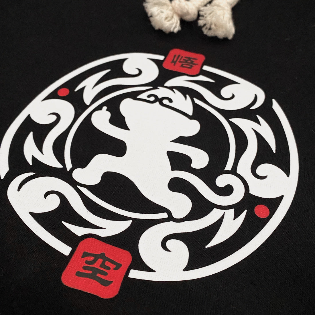 Wukong - a close-up of a minimalist design of Wukong printed on the right of a black shorts-1