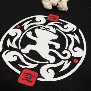 Wukong - a close-up of a minimalist design of Wukong printed on the right of a black shorts-1