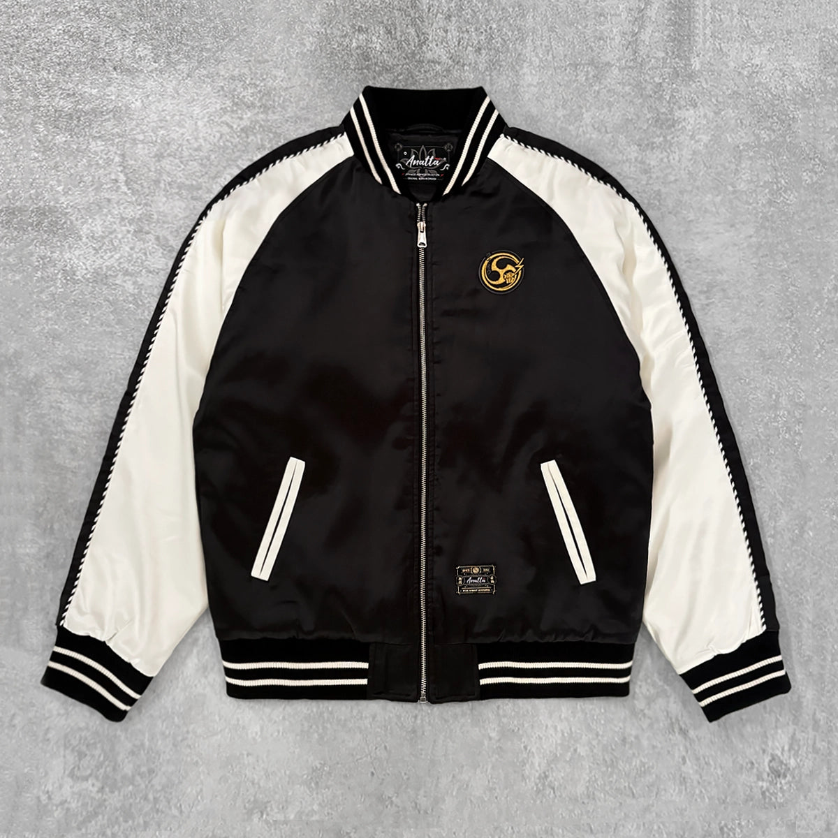Raijin’s Wrath Japanese satin jacket, front view with black and white color-blocked design and embroidered chest logo