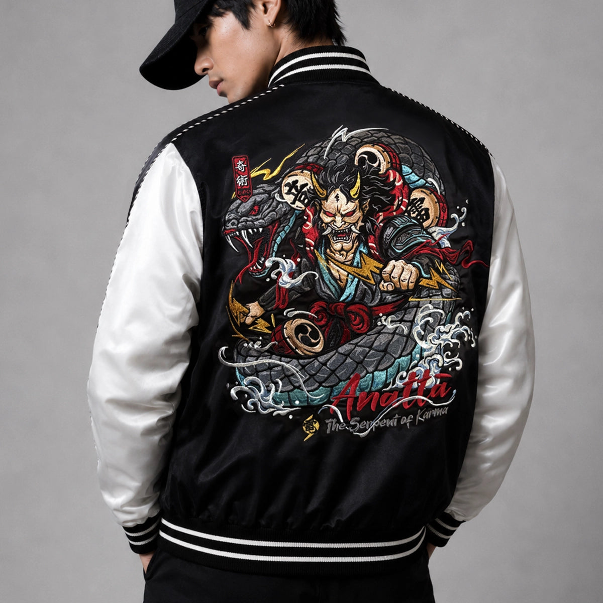 Raijin’s Wrath Japanese satin jacket worn by a model, back view showing oversized Raijin and serpent embroidery